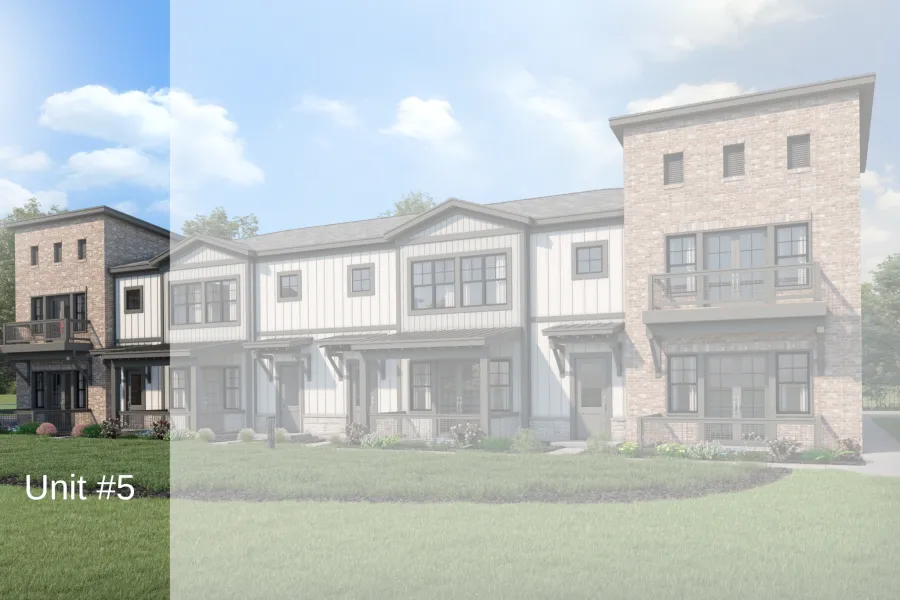 Modern two-story townhouses with brick and white siding exteriors under a clear blue sky