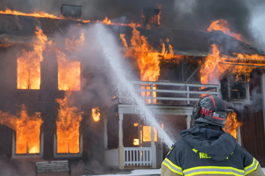 a firefighter putting out a fire