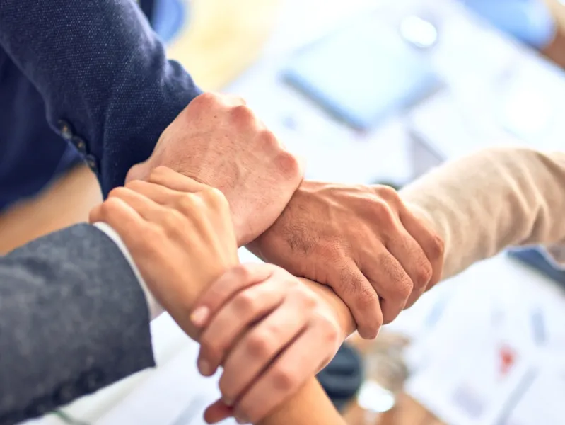 close-up of people shaking hands
