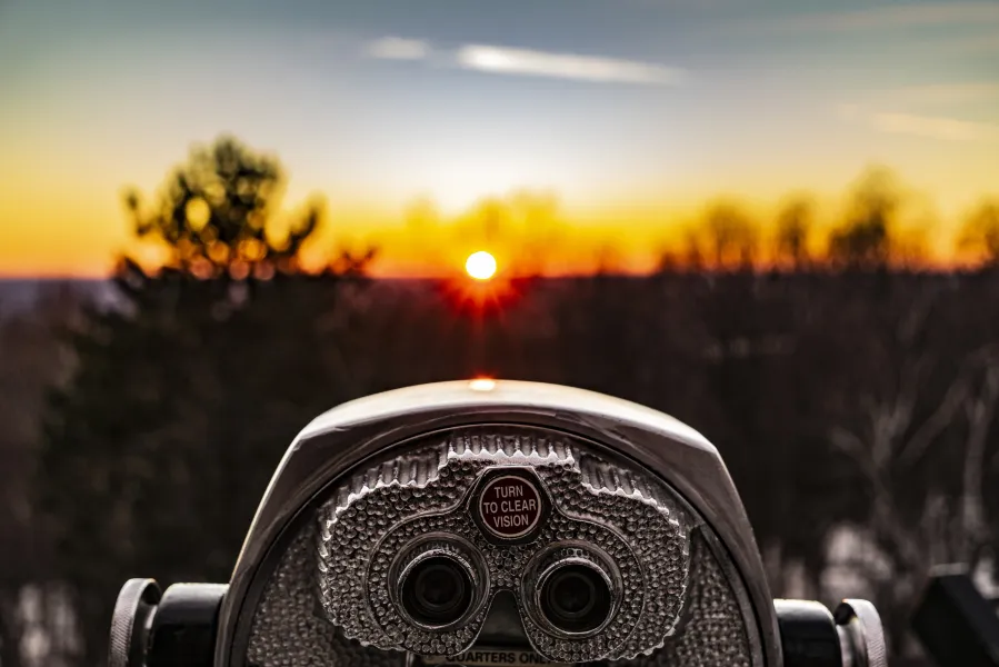 a car with a sun behind it