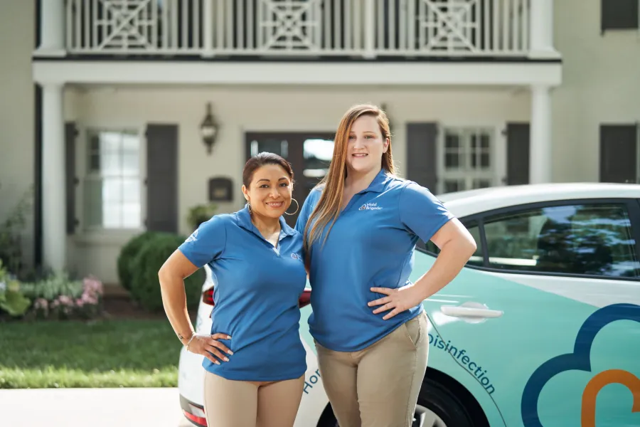two women in blue shirts