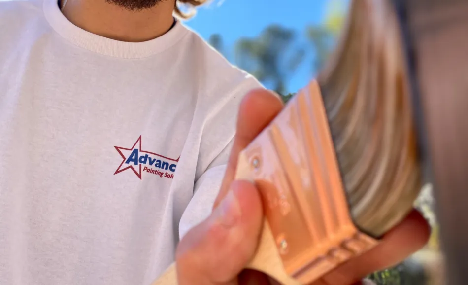 a person holding a paint brush