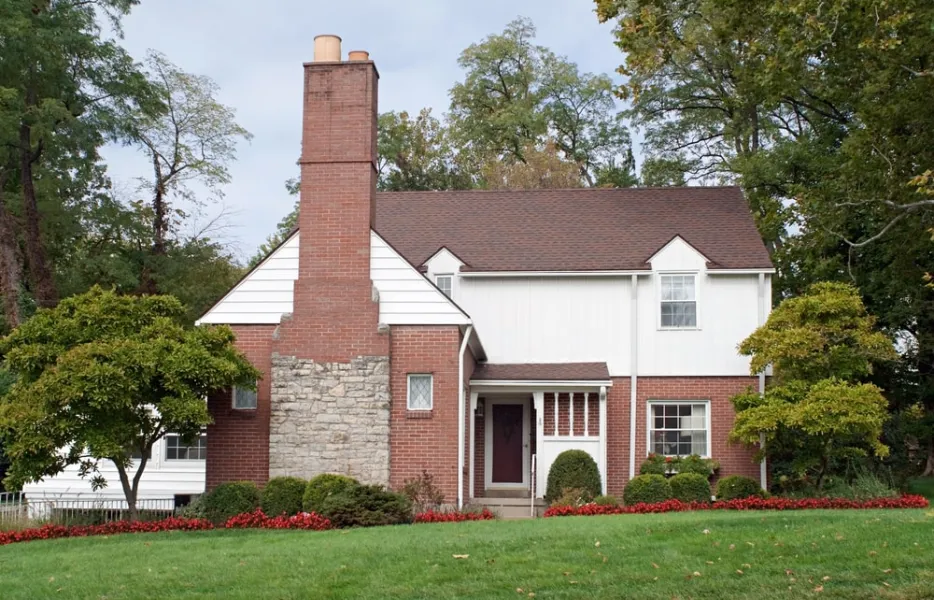 a brick house with a chimney in south windsor, ct