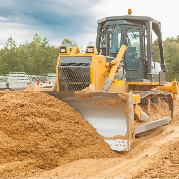 a bulldozer working in a field