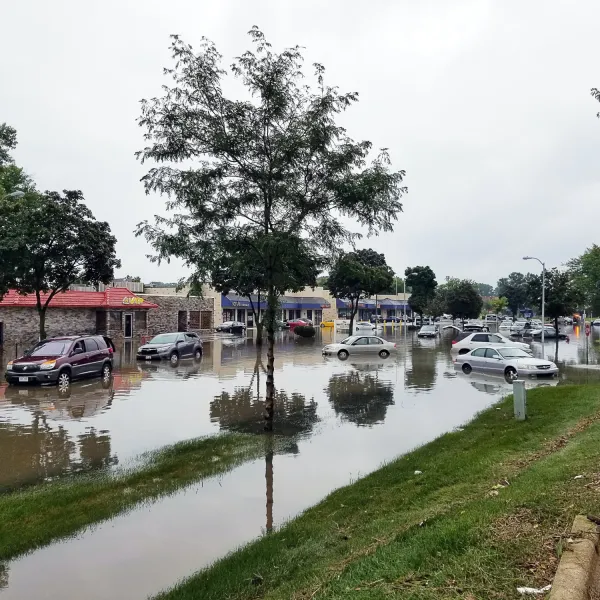 a flooded street with cars