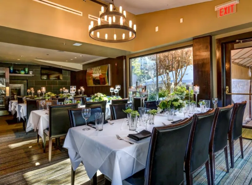 a large dining room with tables set