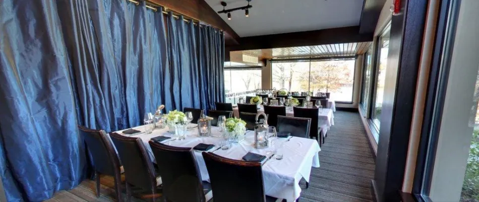 a dining room table in front of a window
