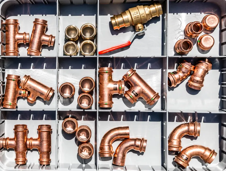 a plumber laying out his tools in atlanta