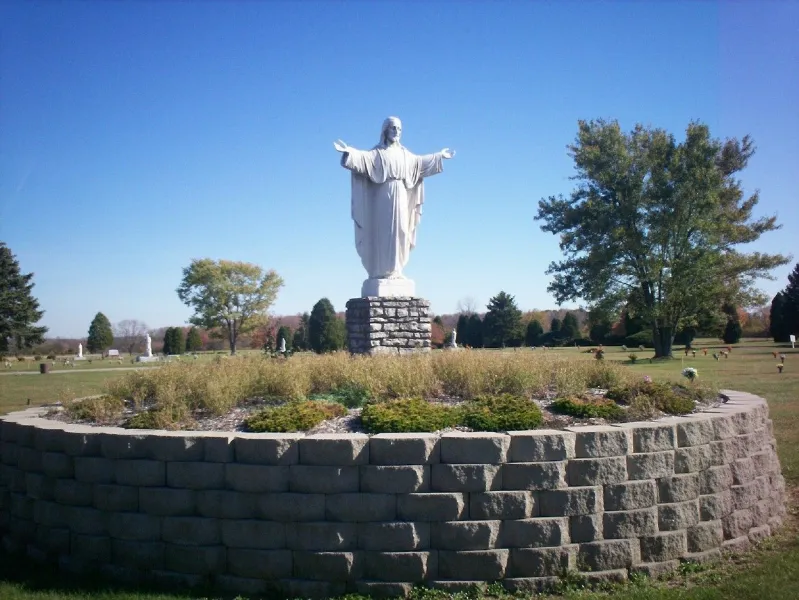 a large stone statue in front of a building