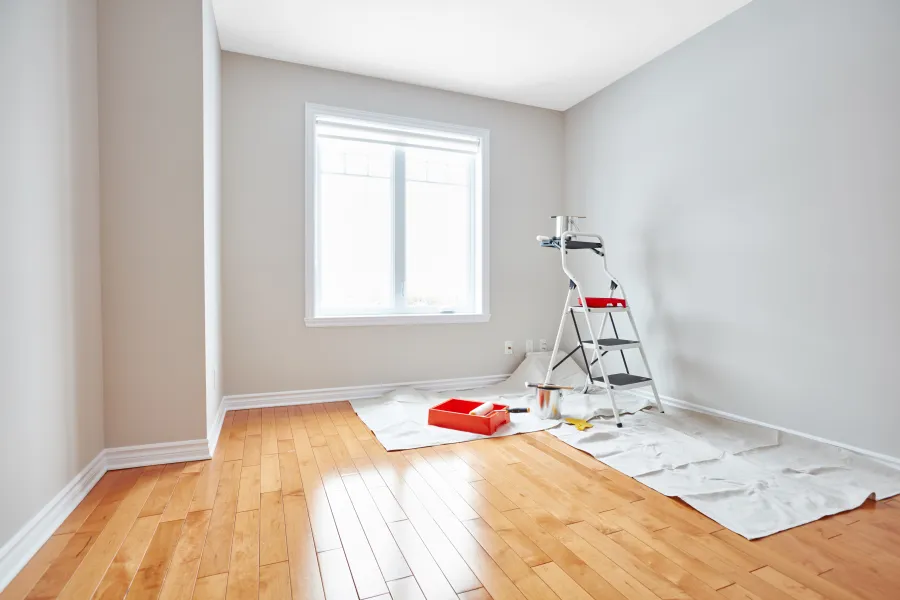 a room with a ladder and a window