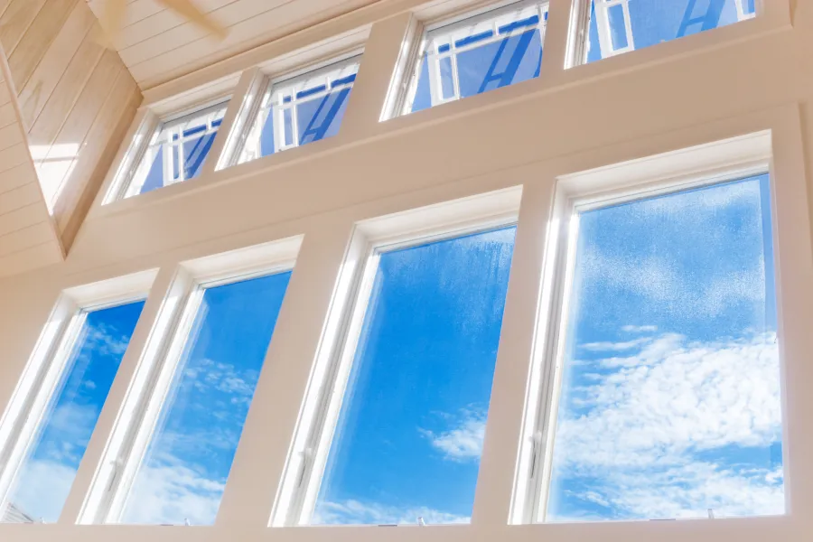 a window with blue sky and clouds