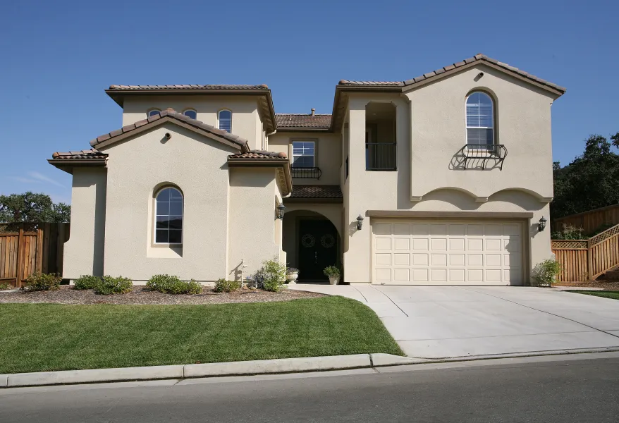a white house with a driveway