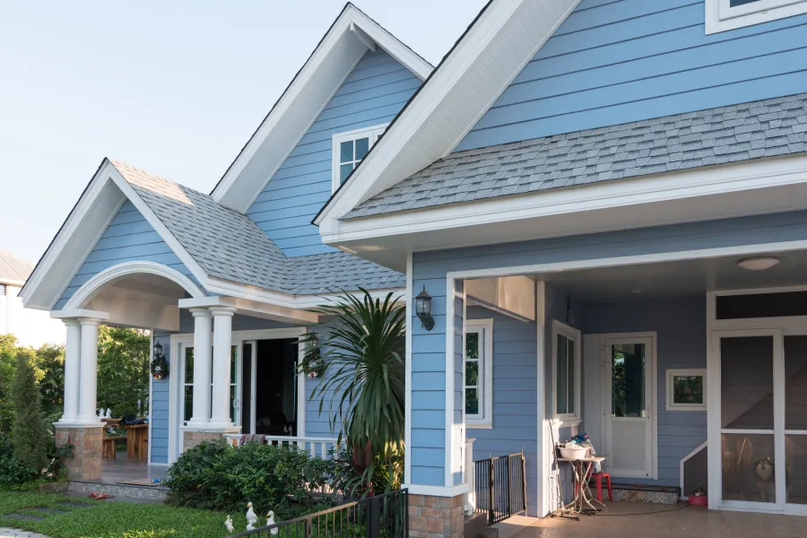 a house with a patio and a table in the front