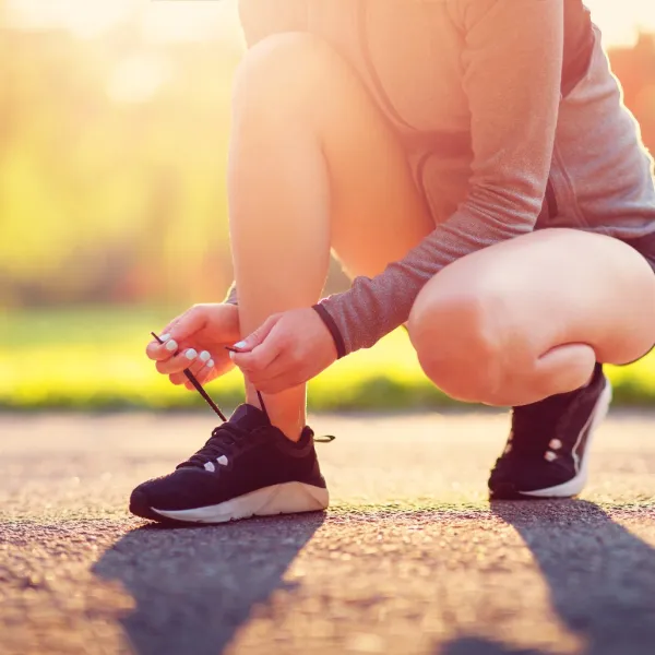 a person tying their shoe