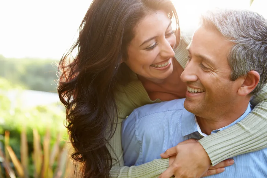 a man and woman embracing