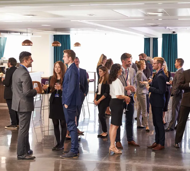 a group of people standing in a room