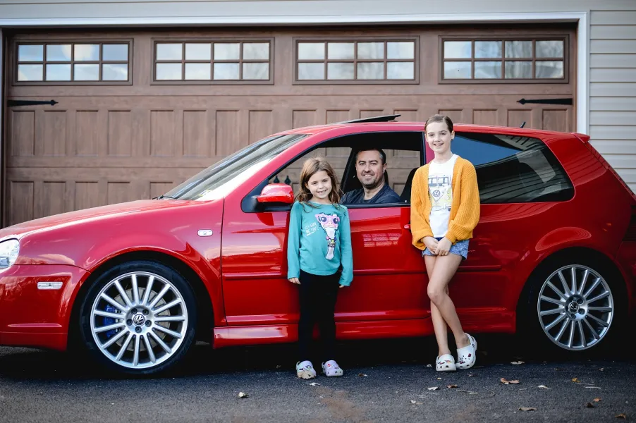 JT with car and daughters