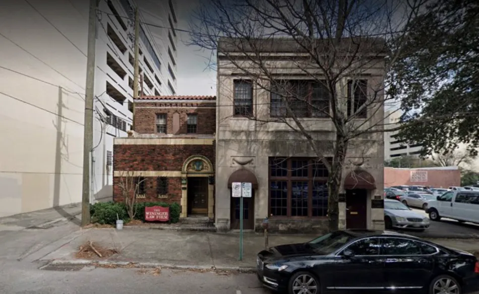 a building with cars parked in front