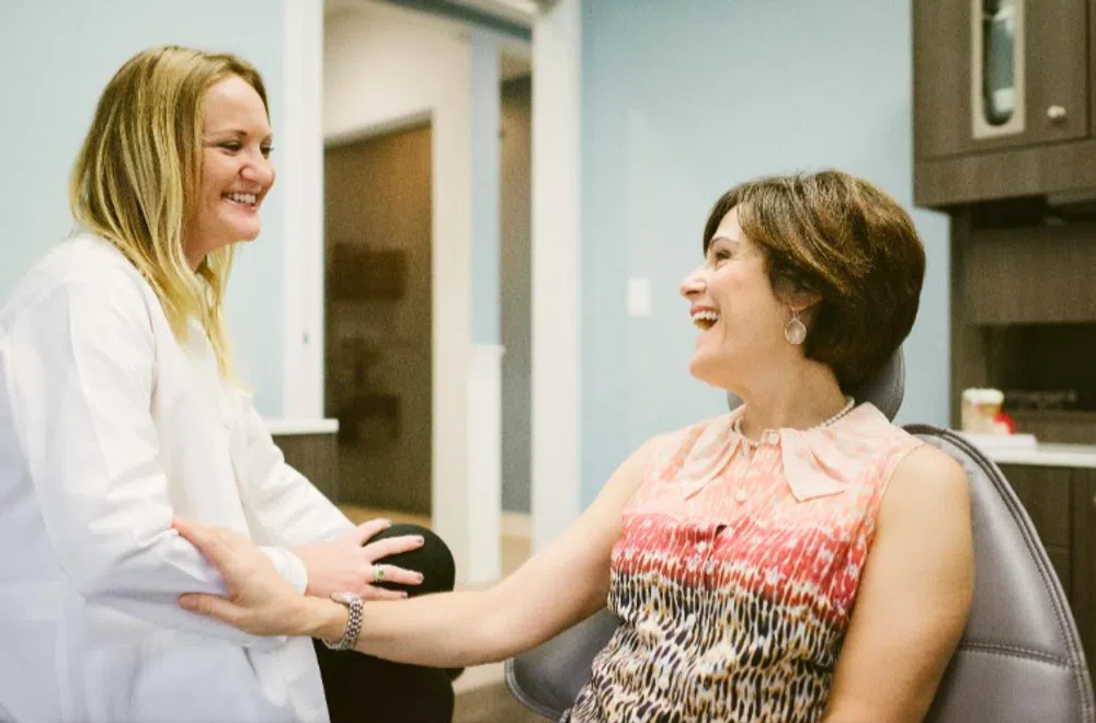 Doctor and patient smiling