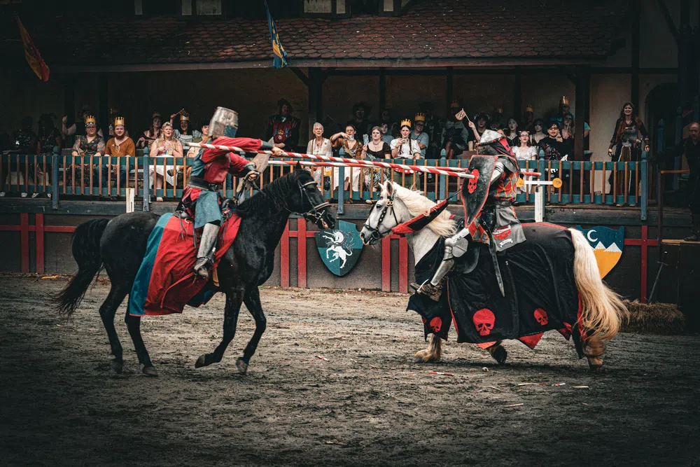 Knights meeting at impact with lances and banners at the Tournament of Champions