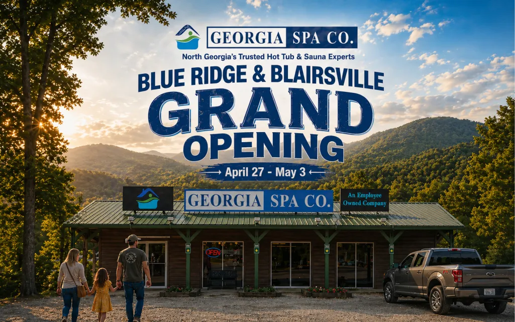 Georgia Spa Co. Grand Opening event in Blue Ridge and Blairsville with a rustic building, truck, and surrounding mountains.