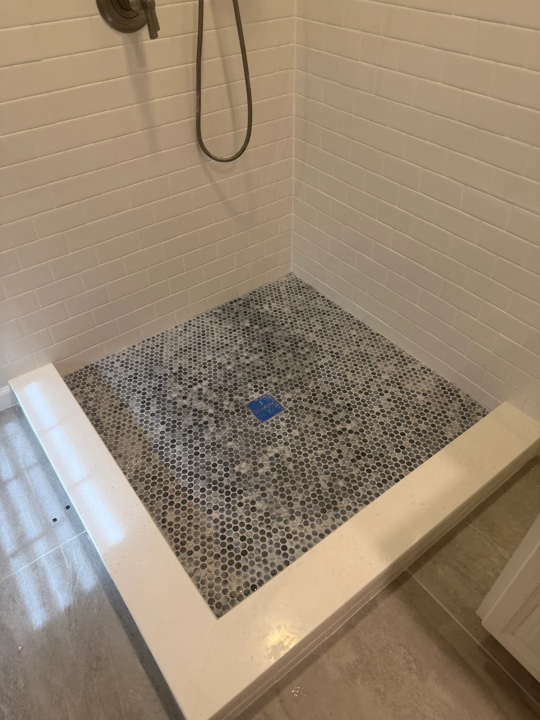 Rebuilt shower pan with tile and drain