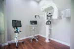 Modern dental imaging room with advanced 3D X-ray machine