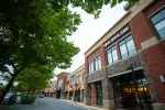 Street view of a modern shopping center with Total Dental Care