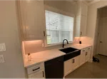 Interior views showcasing white plantation shutters, roller blinds, and kitchen window blinds in modern homes.
