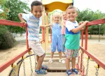 a group of children playing on a playground