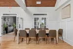 a dining room with a table and chairs