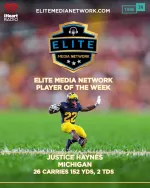 Football player Justice Haynes in Michigan uniform running with the ball, Elite Media Network Player of the Week.