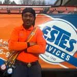 Estes AC and Heating Tech close to an Estes truck