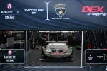 Race car in garage under Andretti WTR and Lamborghini banners supported by DEX Imaging with team members working