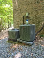 AC Residential Repair in Smyrna by The Air Company of GA. Two outdoor air conditioning units .
