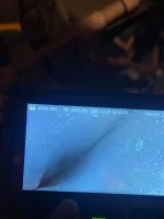 Residential Heating Furnace Repair in Norcross Atlanta 30071 by The Air Company of GA.  Handheld device screen showing close-up image of a textured surface with water droplets and a crease line.