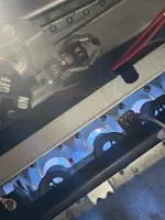 Furnace Heating Repair in Atlanta Decatur 30030 by The Air Company of GA.  Blue flames burning on multiple gas burner ports inside a furnace heating unit with wiring and metal components.