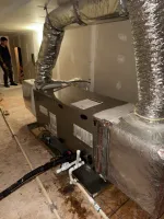 Commercial HVAC system with ductwork and piping installed