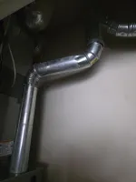 Heating Furnace Repair Marietta 30066 by The Air Company of GA.  Galvanized metal ductwork with angled joints installed along a wall for HVAC ventilation system.