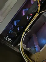 HVAC Repair in Sandy Springs 30328 by The Air Company of GA.  Close-up of a gas furnace burner with blue flames and connected wires inside the heating unit.