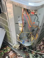 Residential HVAC Repair in Atlanta 30327 by The Air Company of GA.  Open outdoor HVAC unit showing internal wiring, capacitors, and electrical connectors..