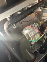 Norcross Atlanta Heating Furnace Repair 30071 by The Air Company of GA.  Close-up of a furnace blower motor and electrical wiring inside a heating unit for HVAC systems.