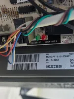 Commercial HVAC Repair in Atlanta Decatur 30317 by The Air Company of GA.  Electronic circuit board with multicolored wires and barcode label on attached component.