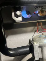 Norcross Atlanta Heating Furnace Repair 30071 by The Air Company of GA.  Close-up of furnace gas valve and igniter with visible blue flames inside heating unit