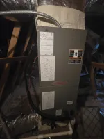 hvac-system-repair-and-capacitor-replacement-atlanta-30307-the-air-company-of-ga Lennox HVAC unit installed in attic with ductwork, insulation, and exposed wooden beams visible.