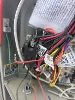 Commercial HVAC Repair in Atlanta Decatur 30317 by The Air Company of GA.  Close-up of electrical wiring and components inside a device with multiple colored wires and labels.