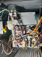 Residential HVAC AC Heating Repair Atlanta Brookhaven 30319 by The Air Company of GA.  Inside view of an HVAC system showing electronic control board with multicolored wiring connected to components and filter.