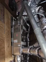 AC Cooling Dehumidification System Installation in Atlanta 30307 by The Air Company of GA. Furnace and HVAC ductwork with insulated air ducts installed in a wooden attic space.