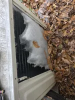 AC Frozen Repair in Atlanta 30327 by The Air Company. Air conditioner condenser coil covered in ice.