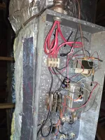 Commercial HVAC Repair in Atlanta 30324 by The Air Company of GA.  Open HVAC metal junction box with various colored electrical wires and connections inside an attic space.